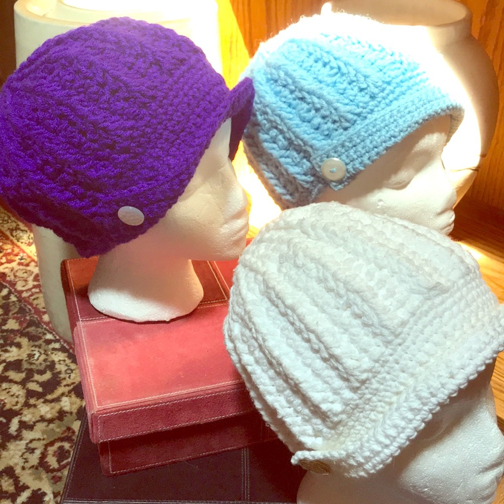 Hand crocheted hat with buttoned brim